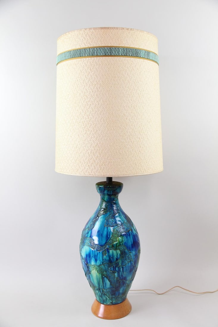 Large Blue & Green Ceramic Lamp: Large Mid-Century Modern Blue & Green Ceramic Lamp. Great mid-century lamp in blue and green glaze with wooden base. Off-white fabric drum shaped shade has matching blue/green trim. Dimensions of the