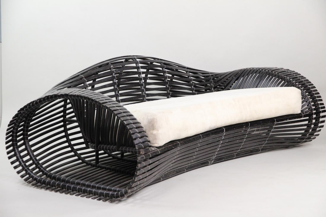 Kenneth Cobonpue Lolah Rattan Sofa: Kenneth Cobonpue Organic Lolah Rattan Sofa. Sofa featuring a distinct handwoven curvaceous black shell inspired by boat-building techniques. With white cushion. Unmarked. Dimensions are 28.5 in h x