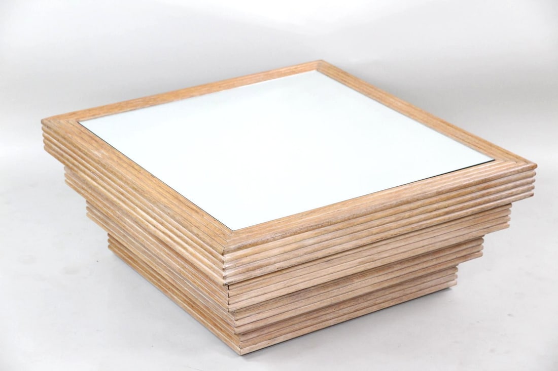 Mirrored Glass Coffee Table, Reeded Wood: Postmodern Mirrored Glass Coffee Table, Reeded Wood. This large coffee table has a three-tiered base made of horizontal ribbed wood and a square mirrored glass top. Dimensions are 16.25 in h x 38.75