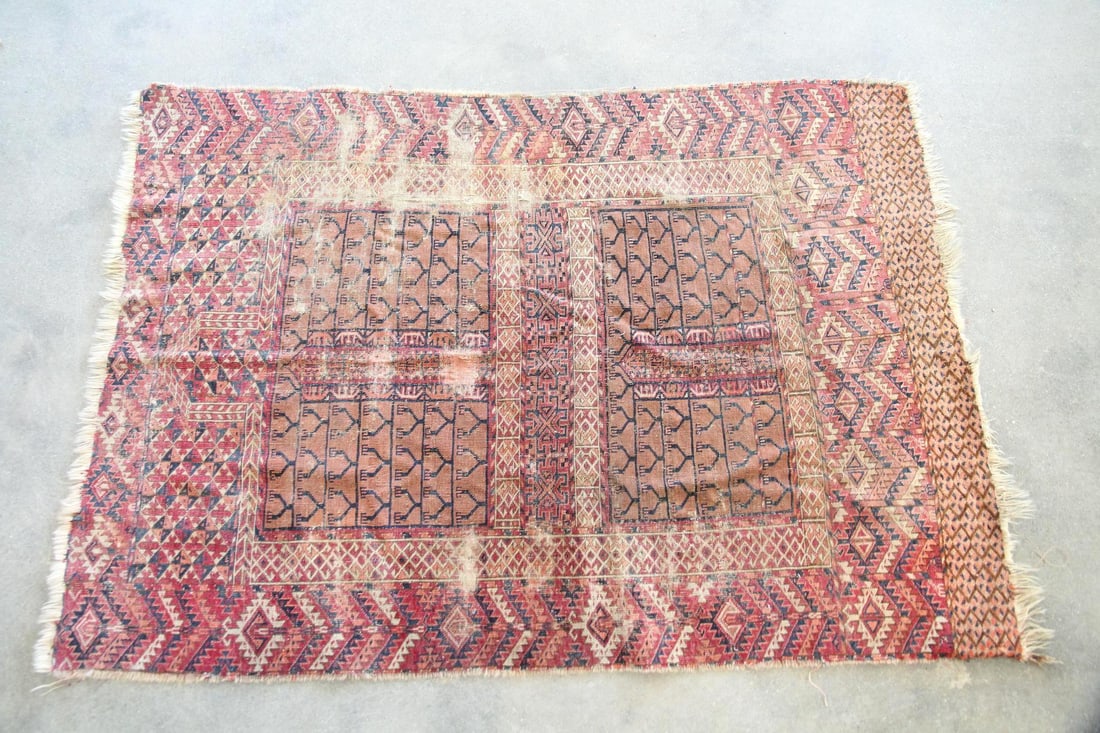 Turkoman Ensi Wool Rug: Tribal Turkoman Ensi Wool Rug. A rug with traditional "hatchli" design in muted reds, brown, and blue. Made of wool with a thin, flexible handle and great character. Dimensions are 59 in l x 39 in w.