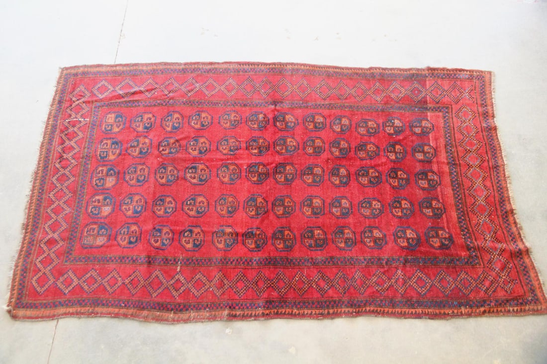Afghan Turkoman Wool Rug, Gul Motif: Afghan Turkoman Wool Rug, Gul Motif. A rug with "elephant's foot" repeating gul motif, in red, navy, and burnt orange. Made of soft wool with a lustrous pile. An older piece with lovely patina.