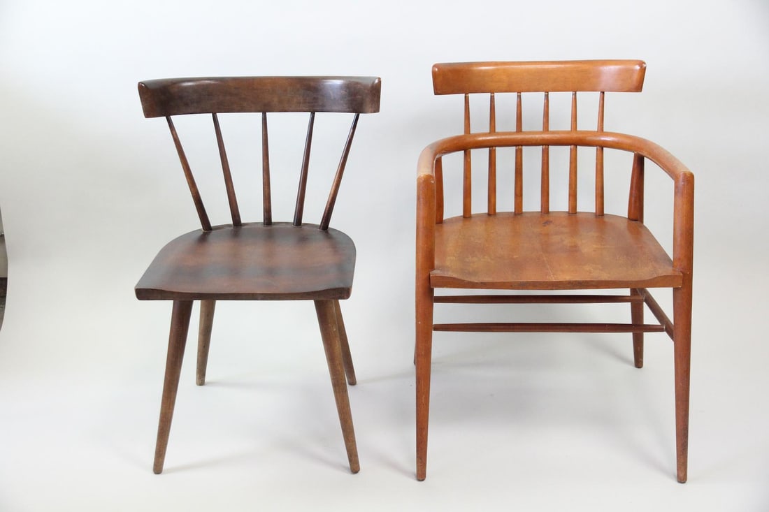 Lot of 2 Paul McCobb Chairs, Captain and DIning: Lot of 2 Paul McCobb Planner Group Spindle Back Chairs. Two Planner group chairs, one with arms and in a lighter wood, and one without and in dark wood. Dimensions of the armchair are 30.5 in h x 21.5