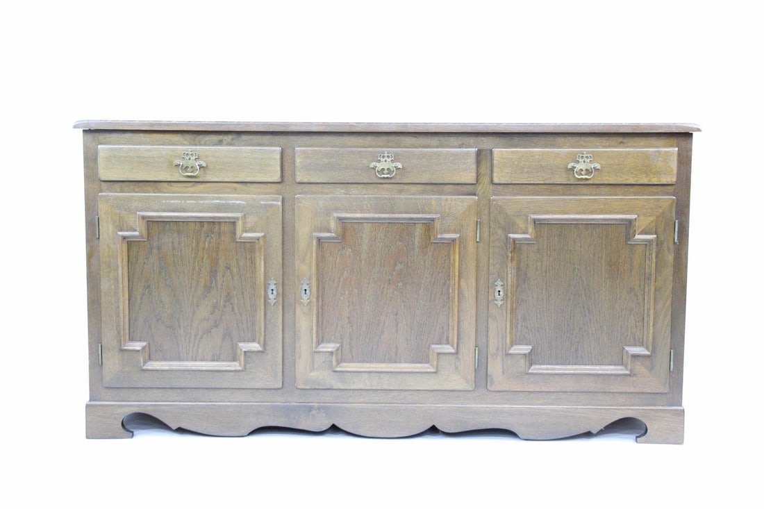 Dark Oak Credenza Cabinet, Hundstrup HM Mobler: Danish Brutalist Dark Oak Sideboard Credenza Cabinet. Nice 3 drawer and 3 door cabinet has carved feet, dark finish and brass pulls. With HUNDSTRUP MÃ˜BELFABRIKA label attached. Dimensions a