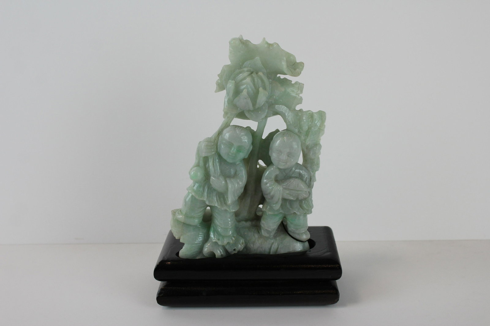 Chinese Jadeite Children Group: Chinese Jadeite Children Group. Detailed Jadeite carving depicting two children and various fauna among the landscape, pale translucent icy green Chinese jadeite. On lacquered wood base. From Private 