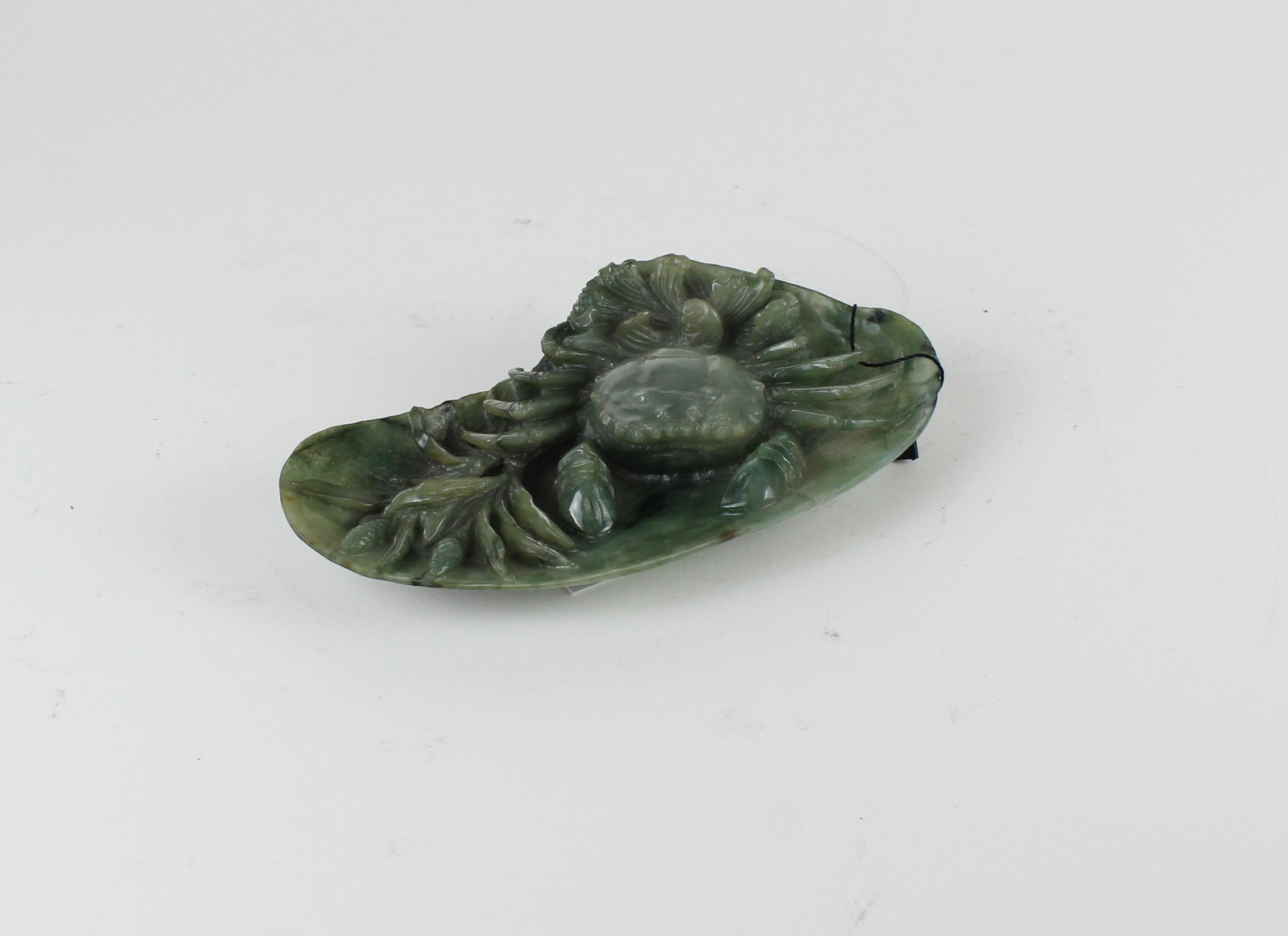 Chinese Jadeite Crab and Oyster Shell Carving: Chinese Jadeite Crab and Oyster Shell Carving. Depicting an intricately carved crab atop an oyster shell flanked with seaweed. The hand-carved Chinese jadeite of olive green, moist appearance. From Lo
