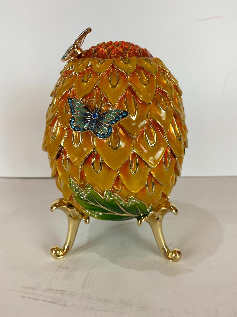 Keren Kopal Faberge Style Large Egg with Butterflies: Keren Kopal Faberge Style Large Egg with Butterflies Trinket Box. Plated with 24K gold and with strategically placed crystals. The trinket box has a magnetic fastener to secure the closure. From Local