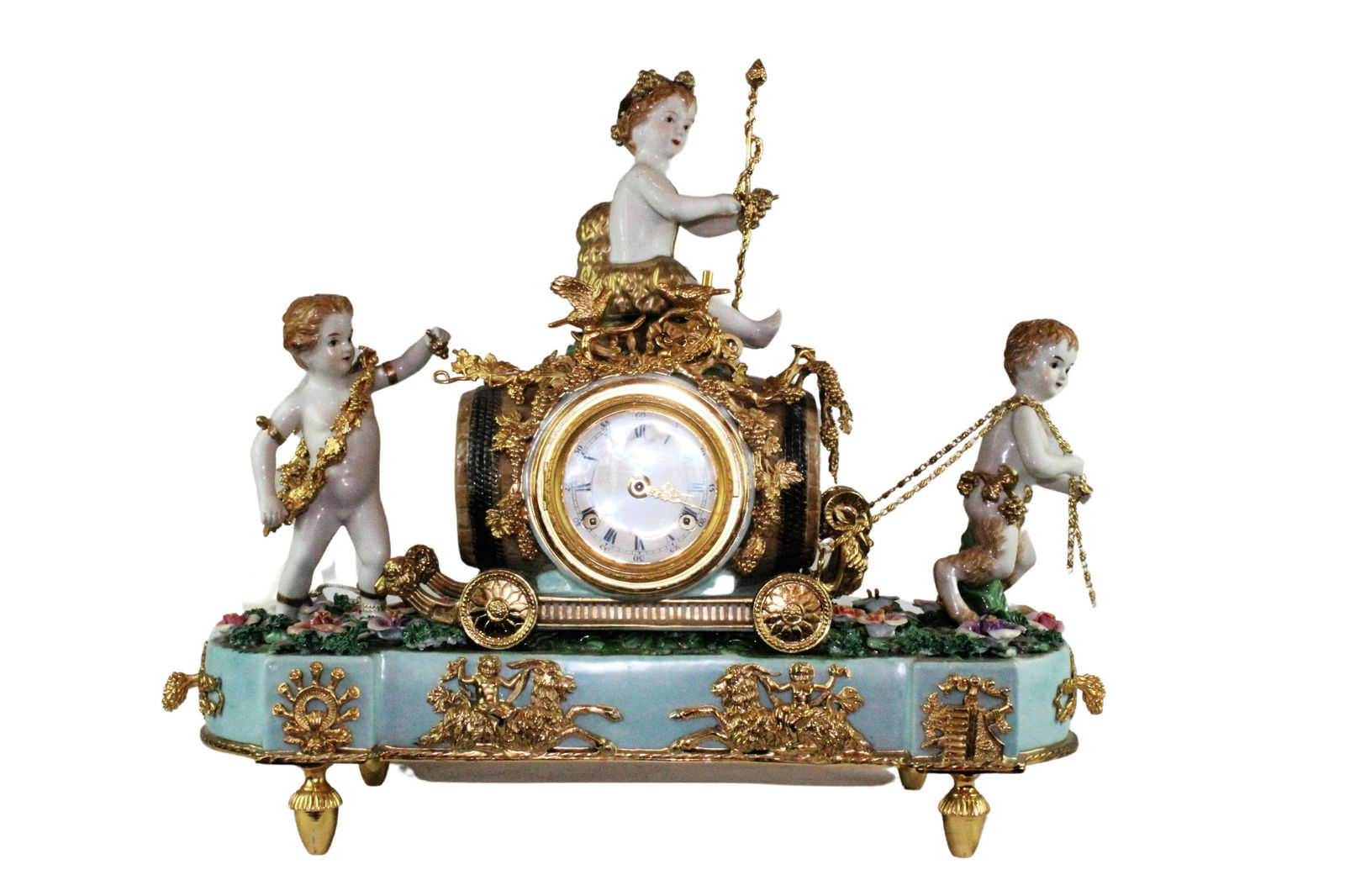 Louis XV Style Hand Painted Porcelain Table Clock: Louis XV Style Hand Painted Porcelain Table Clock, Faun child pulling a wine barrel with two other putti. From Texas Estate. Approximately 17 x 22 x 8 inches