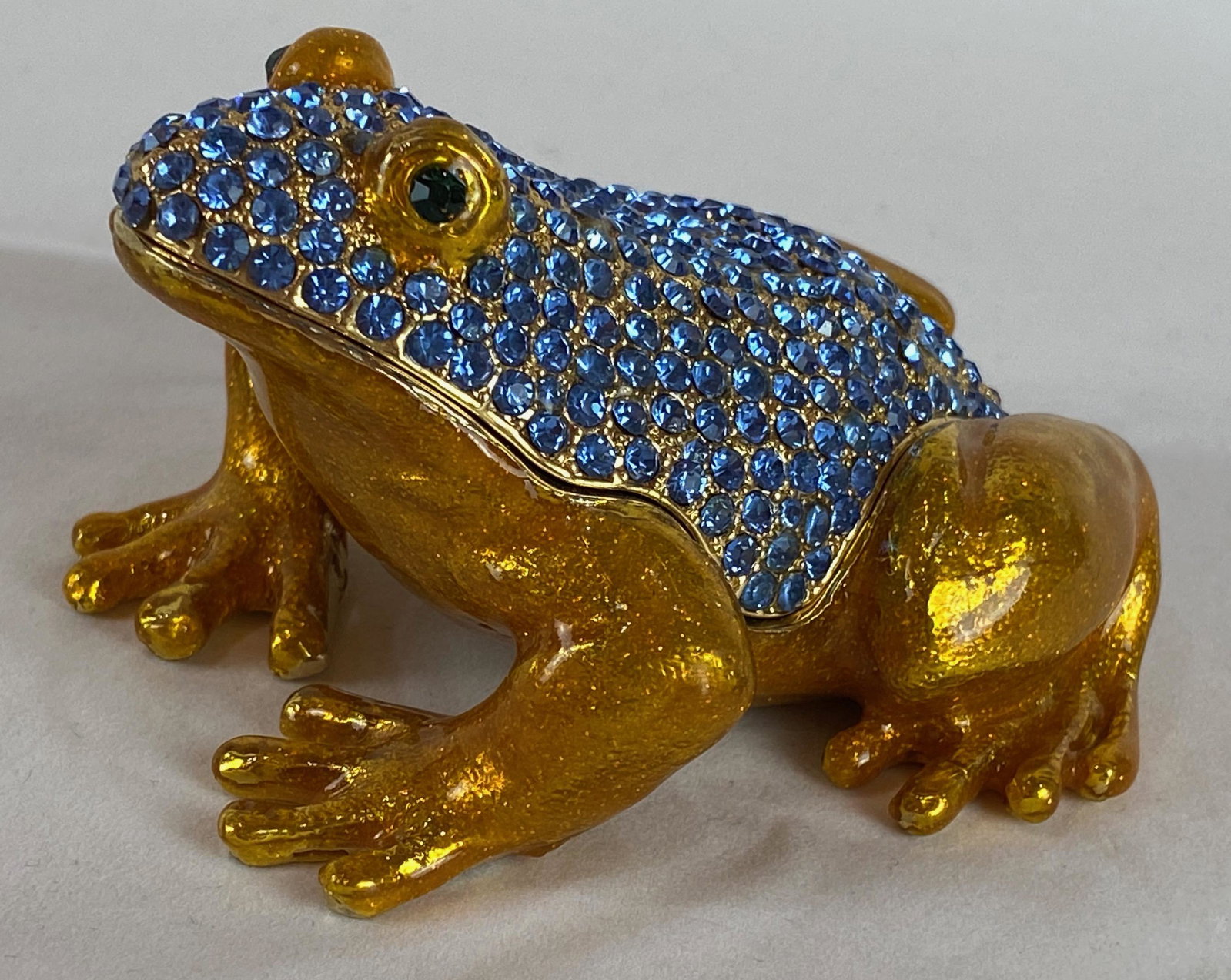 Keren Kopal Faberge Style Large Crystal Inlaid Frog: Keren Kopal Faberge Style Large Crystal Inlaid Frog Trinket Box. Plated with 24K gold and with strategically placed crystals. The trinket box has a magnetic fastener to secure the closure. From Local 