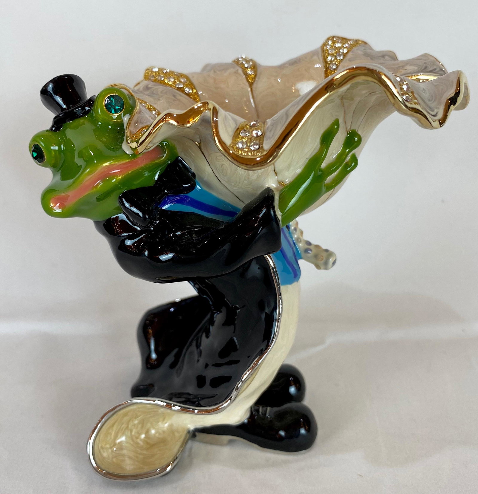 Keren Kopal Faberge Style Frog with a Large Flower: Keren Kopal Faberge Style Frog with a Large Flower Enamel Trinket Bowl. Plated with 24K gold and with strategically placed crystals. The trinket box has a magnetic fastener to secure the closure. From