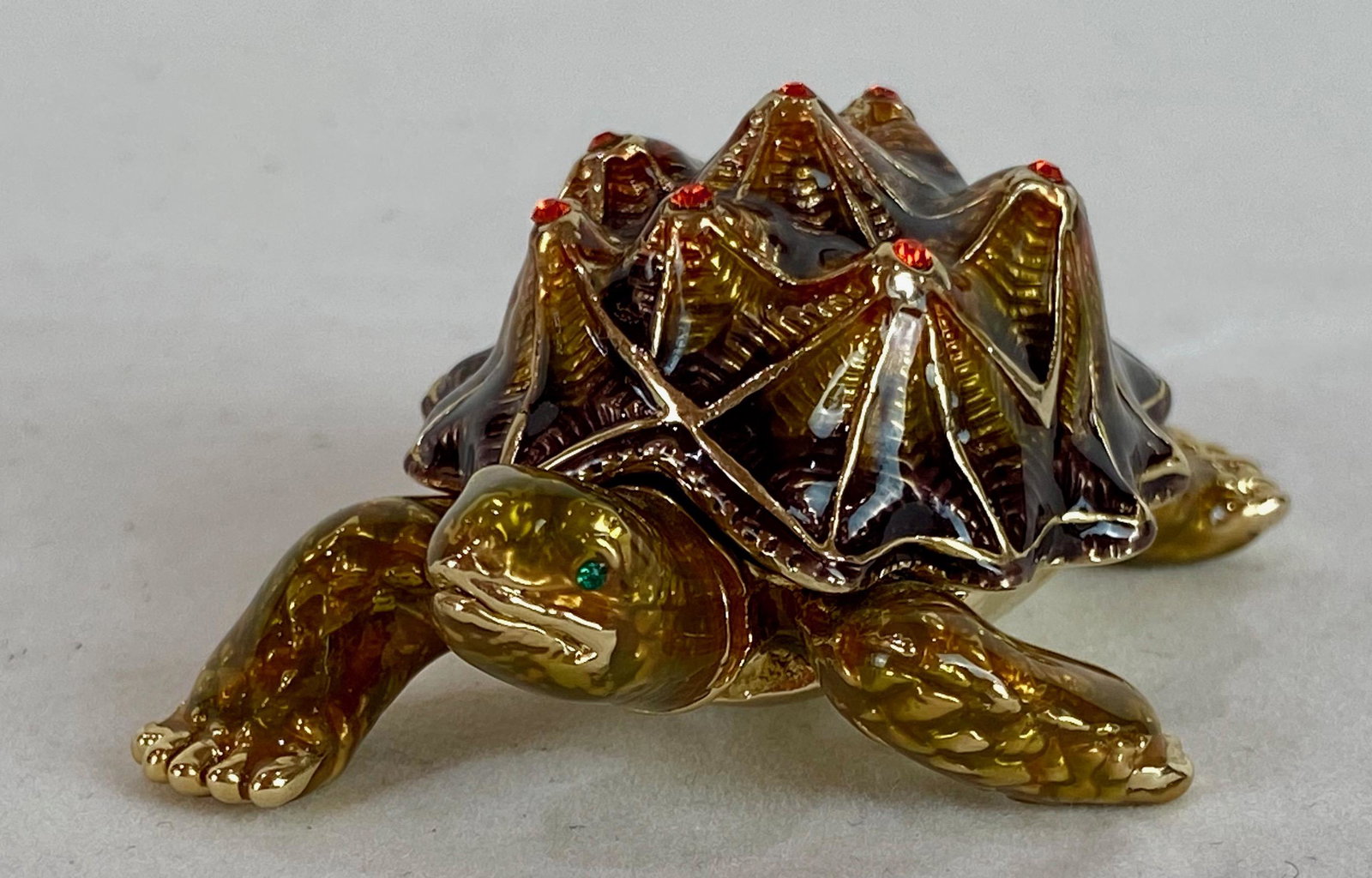 Keren Kopal Faberge Style Tortoise Enamel Trinket Box: Keren Kopal Faberge Style Tortoise Trinket Box. Plated with 24K gold and with strategically placed crystals. The trinket box has a magnetic fastener to secure the closure. From Local Estate Approx 1.5