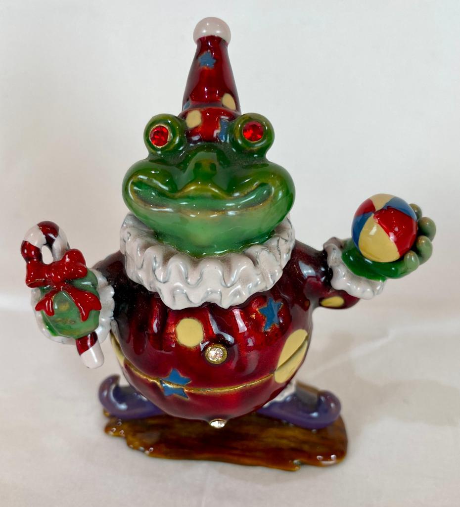 Keren Kopal Faberge Style Clown Frog Enamel Trinket Box: Keren Kopal Faberge Style Clown Frog. Plated with 24K gold and with strategically placed crystals. The trinket box has a magnetic fastener to secure the closure. From Local Estate Approx 3.25 x 2.75 x