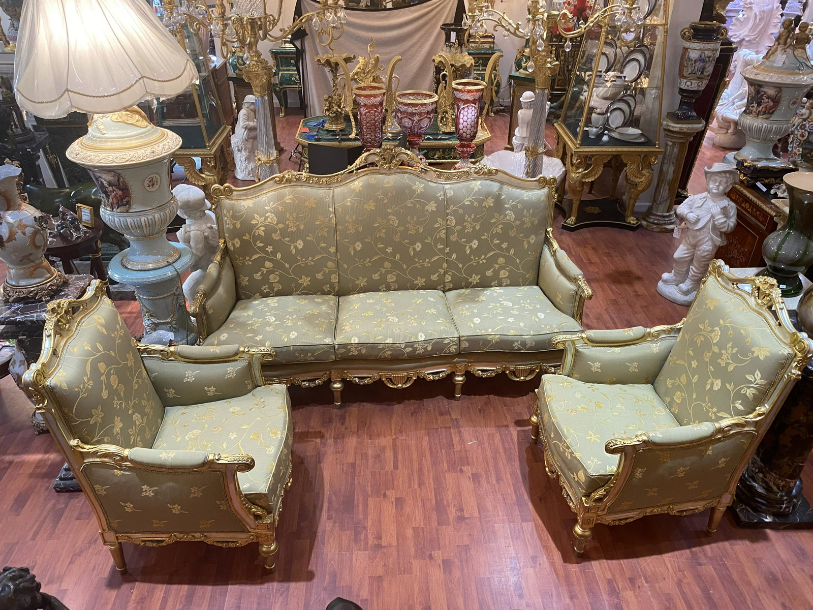 A 5pc Salon Set [Sofa and 4 Chairs]: 5 Piece Victorian Salon Set. Silk Upholstery. Not shown: 2 more chairs. From Healdsburg Estate Approx 26x78x41 inches (Sofa) 27 x 41 x 28 (smaller chairs) inches