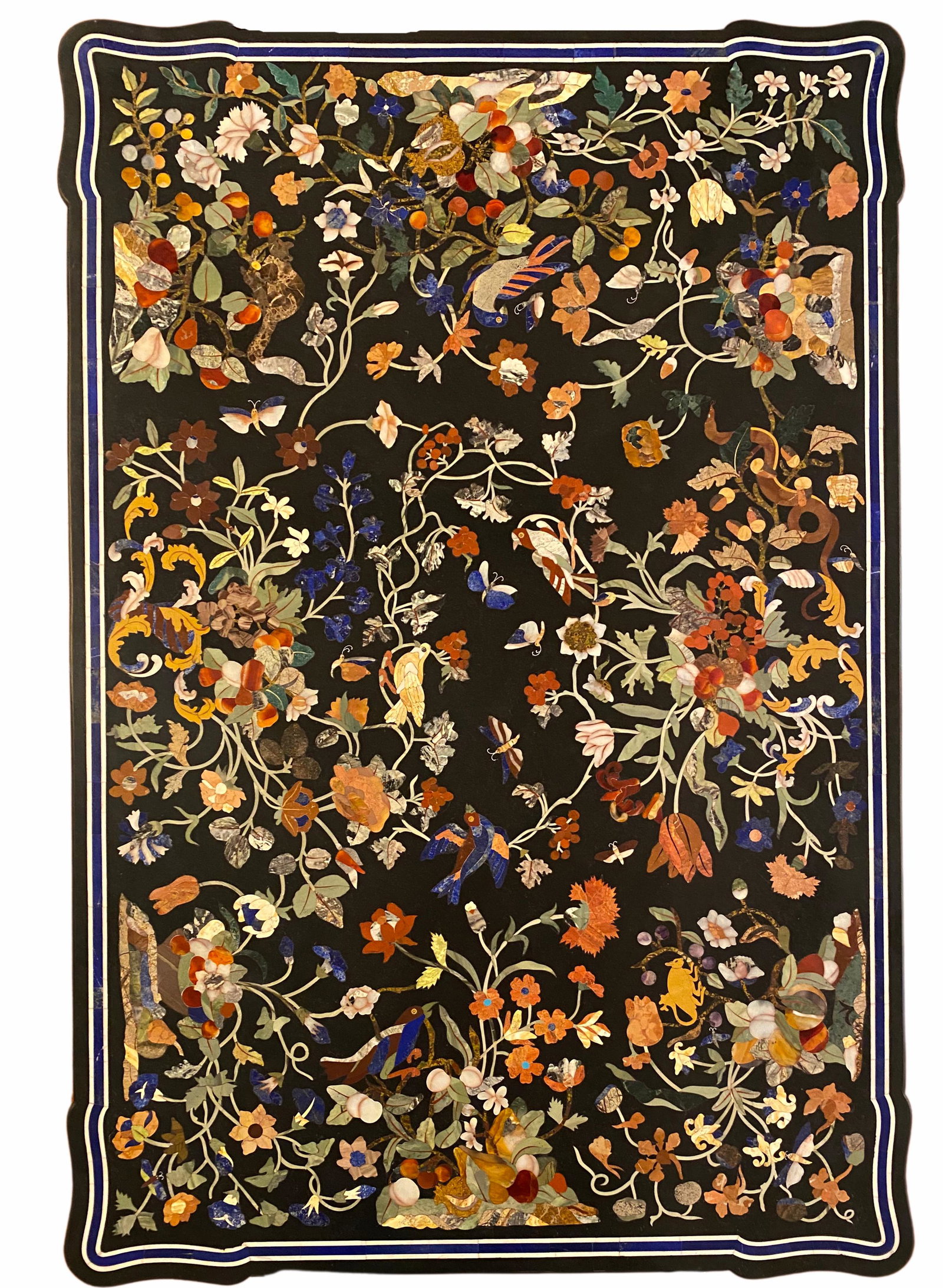 A Marble Table Inlaid with Semi Precious Stones: A large pietra dura table.This Florentine black marble tabletop with its fruit, floral and avian motif is delicately inlaid with a myriad of coloured marbles and semiprecious stones: lapis lazuli, ame