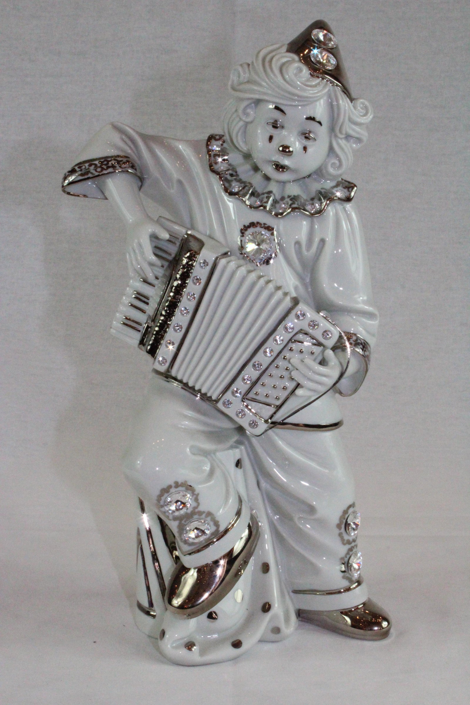 Limoges Porcelain w/ Swarovski Crystals ''Clown w/: Limoges Porcelain w/ Swarovski Crystals ''Clown w/ Accordian'' Approximately 10 x 5 x 3 inches