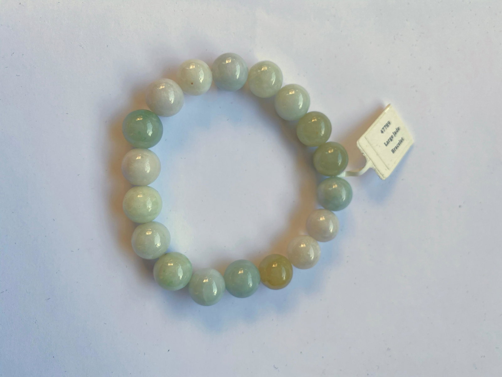Jade Bead Bracelet: Jade Bead Bracelet on elastic cord. Approximate Dia 2.5", bead size 3/8"