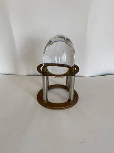 Crystal Egg on Brass Stand: Crystal Egg on Brass Stand Approximate Dimensions Egg- 4.5" H x 3.5" Diameter, Stand 4.5" H x 5.25" Diameter, Together 7.5" H