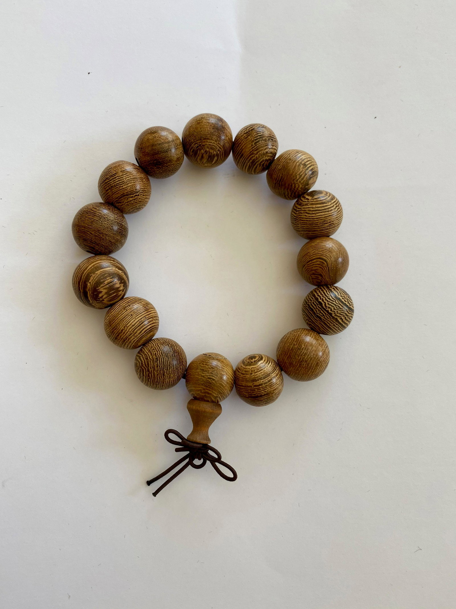 Carved Wood Bead Bracelet: Carved Wood Bead Bracelet on an elastic cord See photos for size