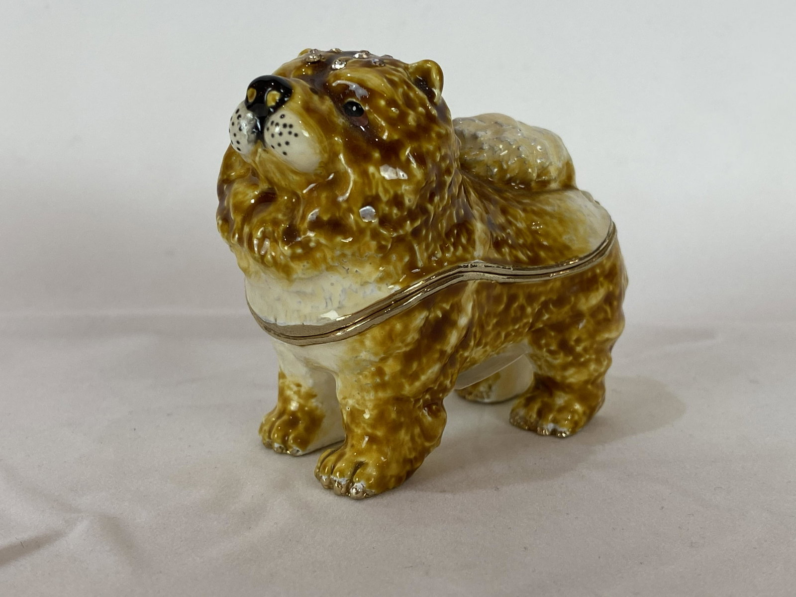 Keren Kopal Faberge Style Chow Chow Puppy Enamel: Keren Kopal Faberge Style Chow Chow Puppy Trinket Box. Plated with 24K gold and with strategically placed crystals. The trinket box has a magnetic fastener to secure the closure. From Local Estate App