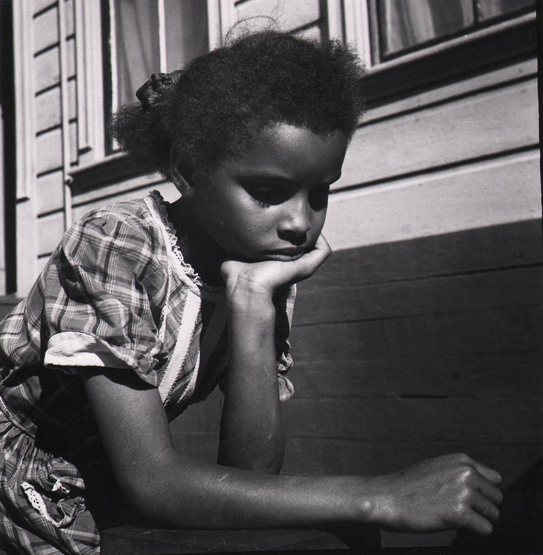 CALIFORNIA MID-CENTURY: Ruth-Marion Baruch: Ruth-Marion Baruch, Black child leaning on arm, San Francisco, 1953, Vintage gelatin silver print, 6.5" x 8". Crop marks/notes and photographer's information in pencil on verso. Artist Biography: Phot