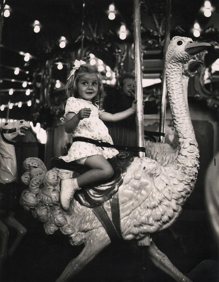 CALIFORNIA MID-CENTURY: Ruth-Marion Baruch: Ruth-Marion Baruch, Carousel, San Francisco Zoo, 1948, Vintage gelatin silver print, 10" x 8". Crop marks and photographer's information in pencil on verso. Number stamped on verso. Artist Biography: 