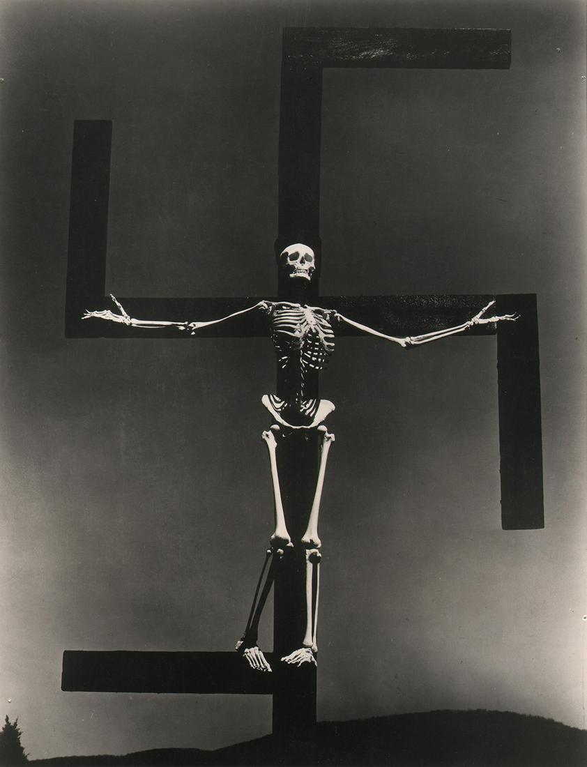 Paul Strand, Skeleton/Swastika Press Photo, 1938/39: Paul Strand, Skeleton/Swastika Film Still, Connecticut (Press Photo), 1938 or 1939, Vintage gelatin silver print, 10" x 8". Matted. "Skeleton, 1-42" in pencil on verso. Number printed on verso.