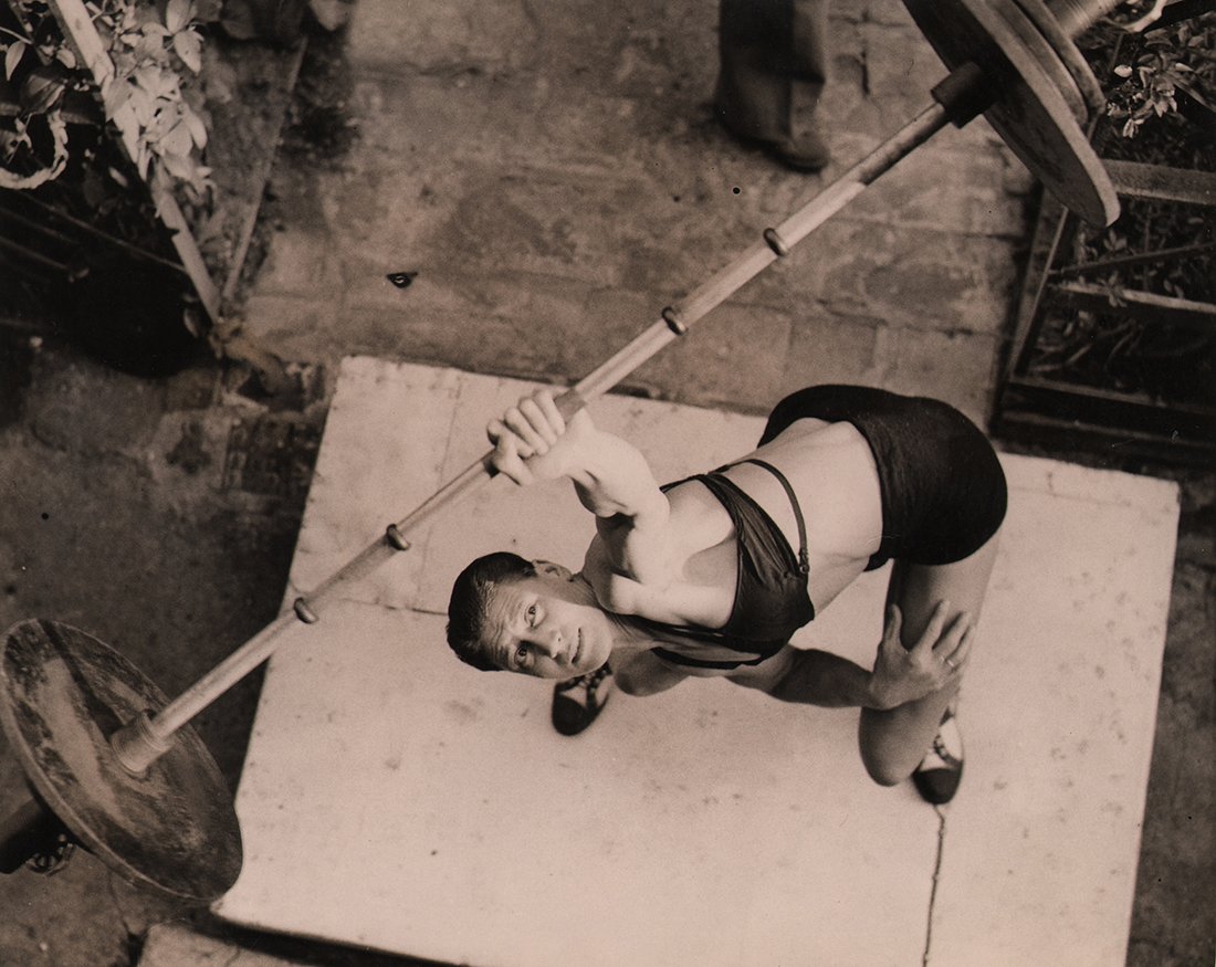 Fox Photos, Miss Ivy Russell, 1937: Fox Photos, Miss Ivy Russell "Strong Girls in World Championship," 1937, Vintage gelatin silver print, 8" x 10". Title in pen on verso. Date stamped on verso. Credit stamped on verso. Typed caption af