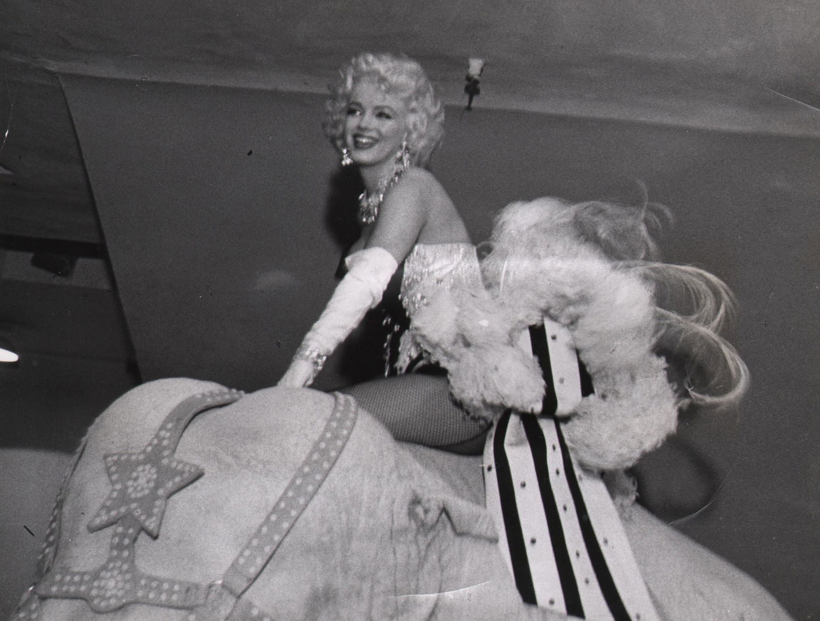 European, Marilyn Monroe at the Circus, 1955: European, Marilyn Monroe at the Circus, Madison Square Garden, 1955, Vintage gelatin silver print, 6.5" x 8.5". Typed caption affixed to verso.