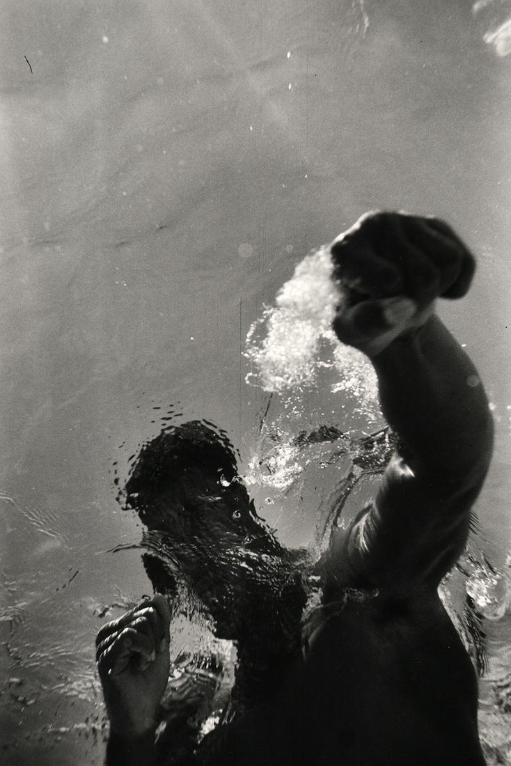 Flip Schulke, Ali Boxing Underwater, 1961: Flip Schulke, Ali Boxing Underwater, 1961, Gelatin silver print, 14" x 11". Artist's credit affixed to verso. Artist Biography: Flip Schulke, a native of New Ulm, Minnesota and a 1954 graduate of Maca