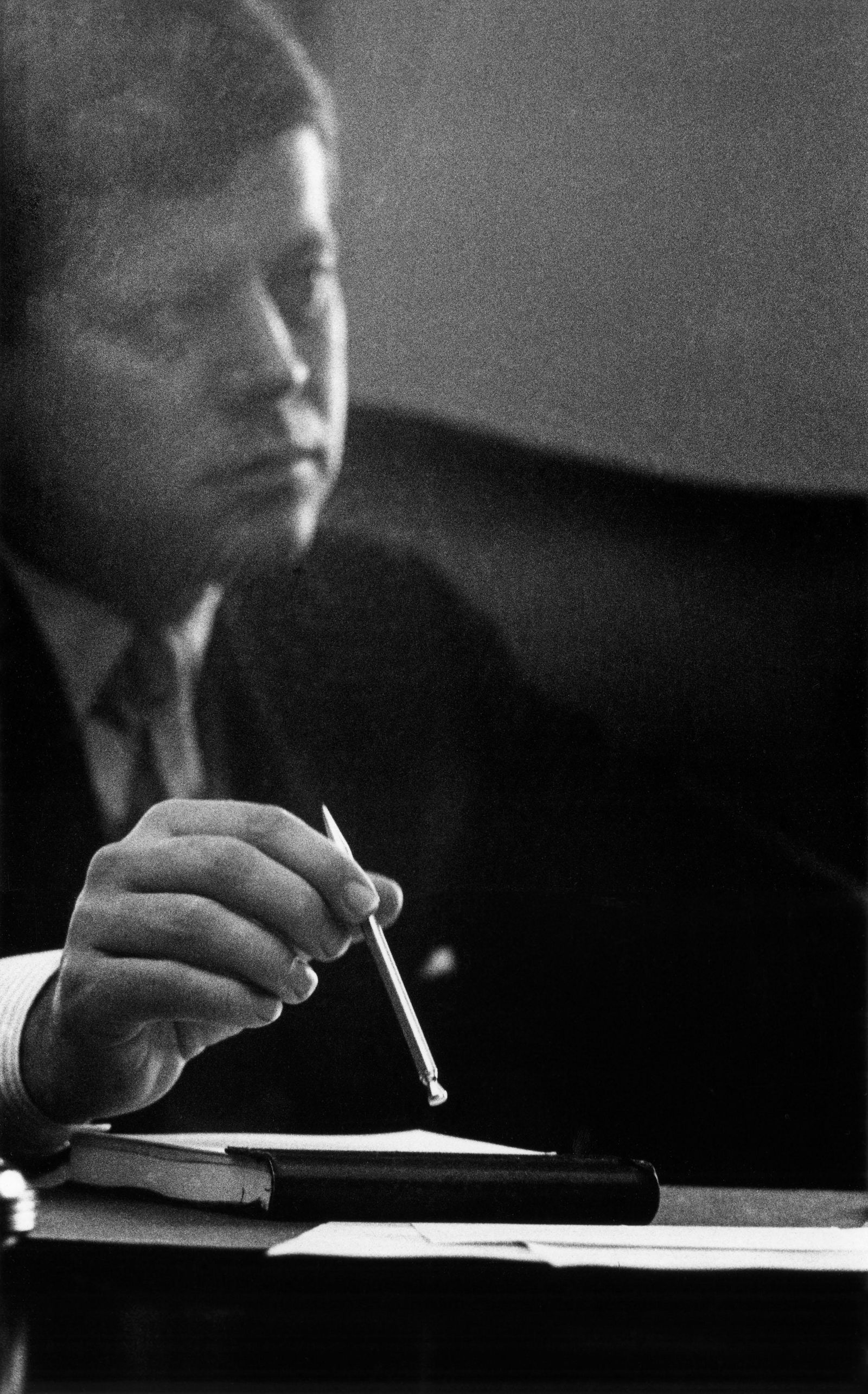 CORNELL CAPA JFK, Pencil in Hand, 1961: CORNELL CAPA (1918-2008), JFK, PENCIL IN HAND, 1961 gelatin silver print, printed later; 16 3/4 x 10 3/8 in. (image), 16 x 20 in. (sheet); signed: artist label verso initialed with titled, date and co
