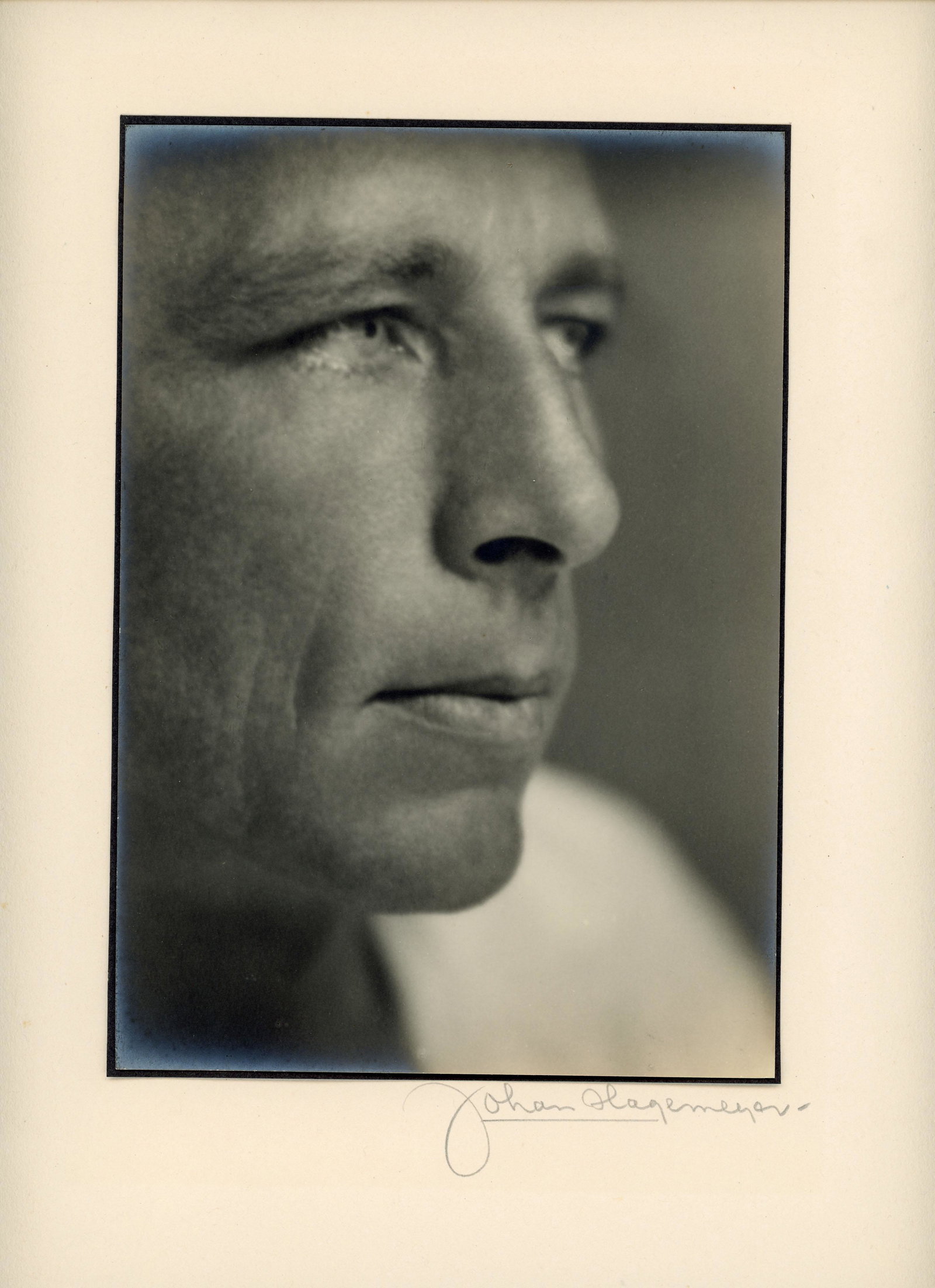 JOHAN HAGEMEYER Robinson Jeffers, 1929: JOHAN HAGEMEYER (1884-1962) ROBINSON JEFFERS, 1929 vintage gelatin silver print; 8 3/4 x 6 in. (image), 18 x 14 in. (mount); signed on mount recto in pencil; inscribed, signed, dated on mount verso in