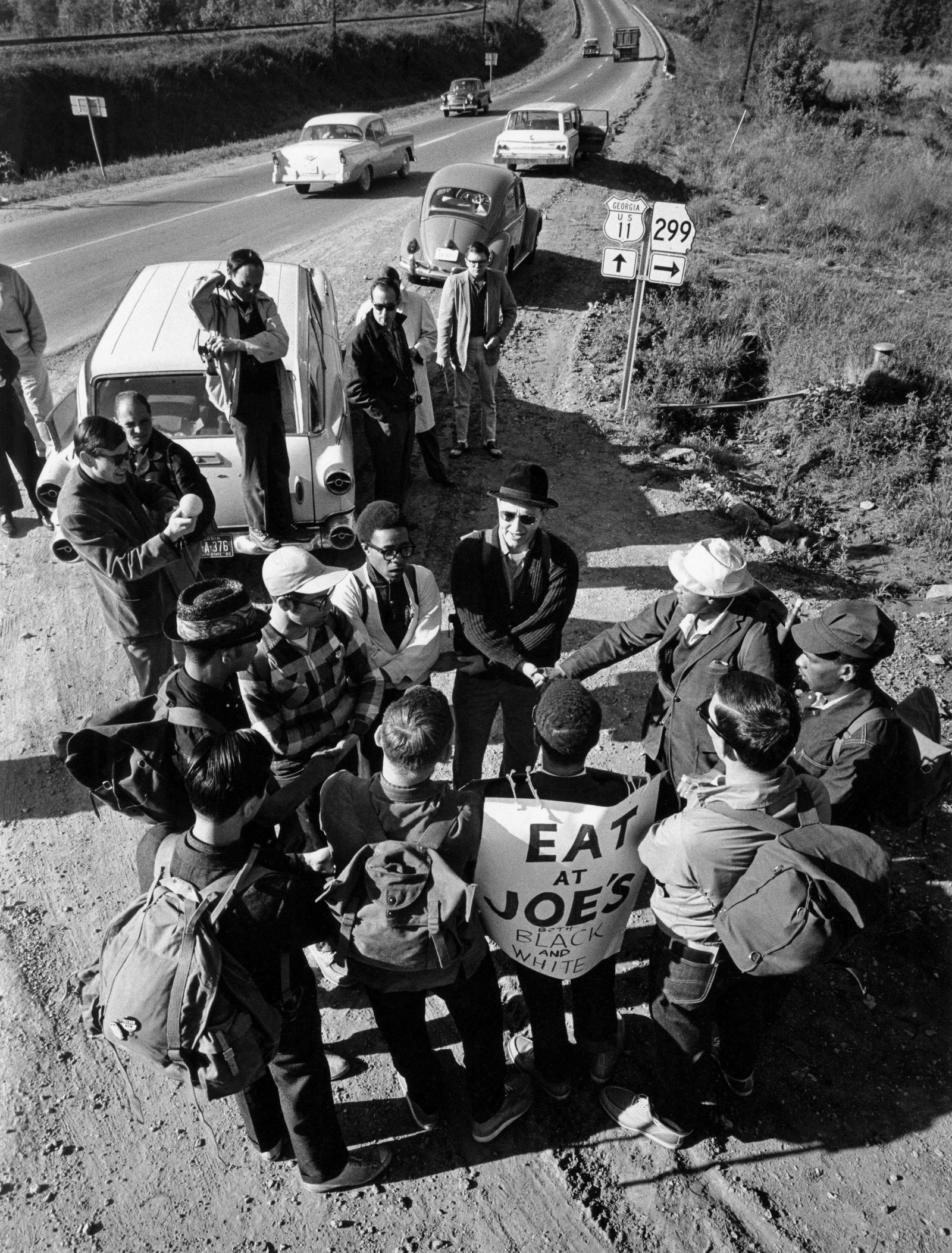 CHARLES MOORE After spending their first night, 1963: Charles Moore (1931-2010), AFTER SPENDING THEIR FIRST NIGHT IN A SMALL NEGRO CHURCH, THE MARCHERS JOIN HANDS AND SING Â“WE SHALL OVERCOME.Â” 1963 gelatin silver print, printed later; 13 1/16 x 9