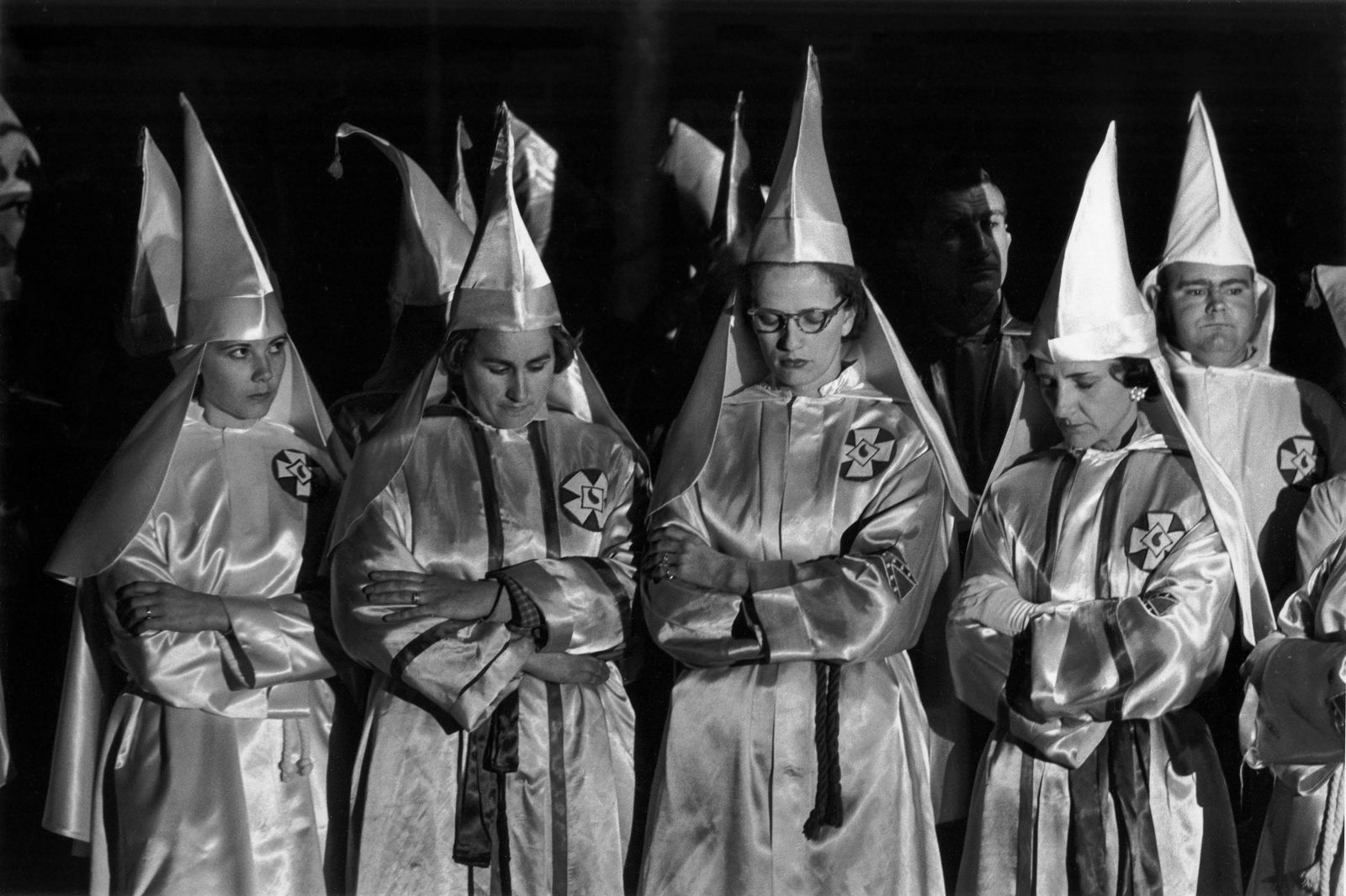 CHARLES MOORE Women of the Klan Bow their Heads in: CHARLES MOORE (1931-2010), WOMEN OF THE KLAN BOW THEIR HEADS IN PRAYER, SALISBURY, NC, 1965 gelatin silver print, printed later; 8 11/16 x 13 in. (image), 11 x 14 in. (sheet); signed verso in pencil;