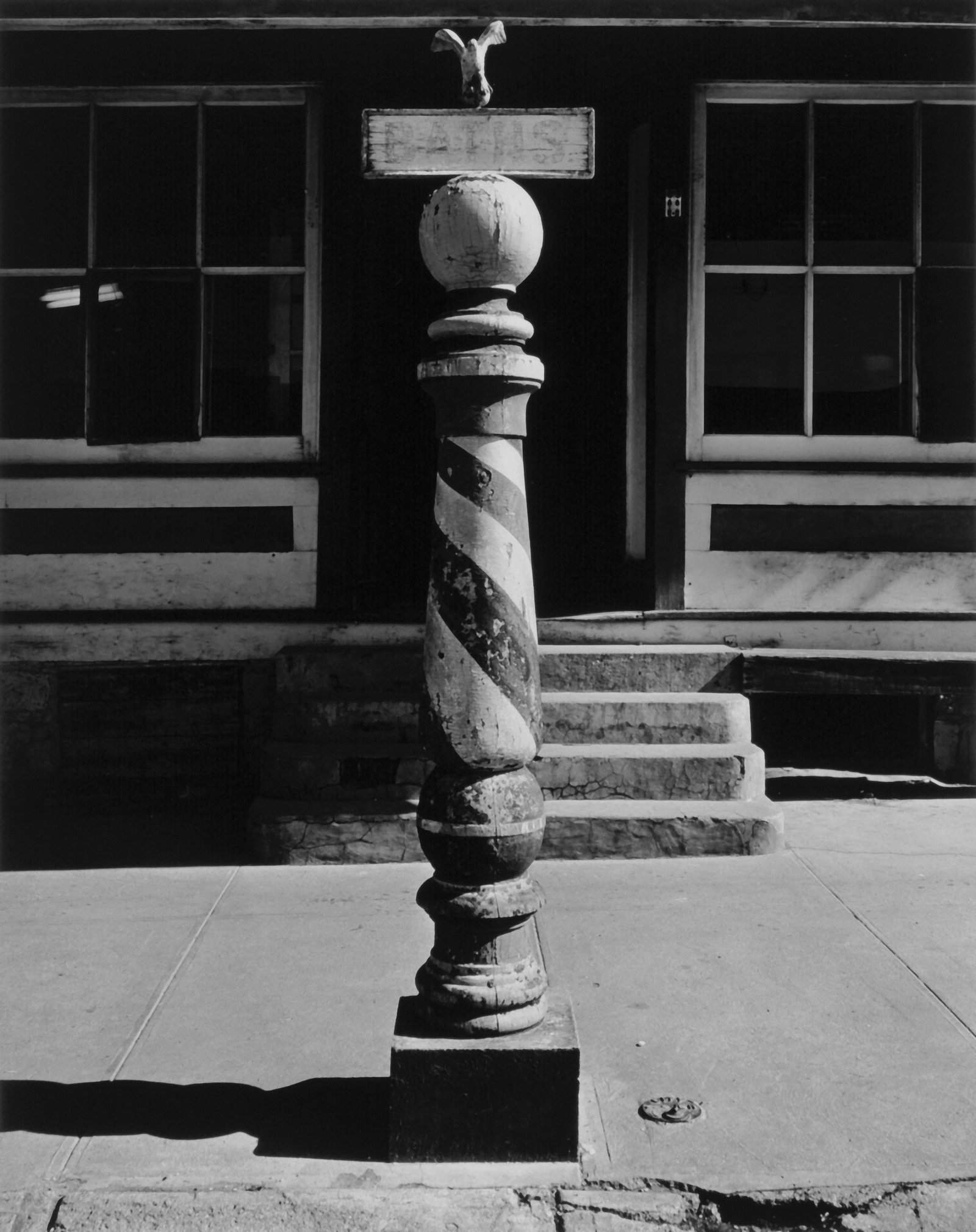 Barber Pole, Weeping Water, Nebraska, 1947: WRIGHT MORRIS (1910-1998), BARBER POLE, WEEPING WATER, NEBRASKA, 1947 gelatin silver print, printed 1980, from the Wright Morris portfolio (1981) ed. 23/50; 9 1/2 x 7 1/2 in.(image), 18 1/2 x 15 in. (