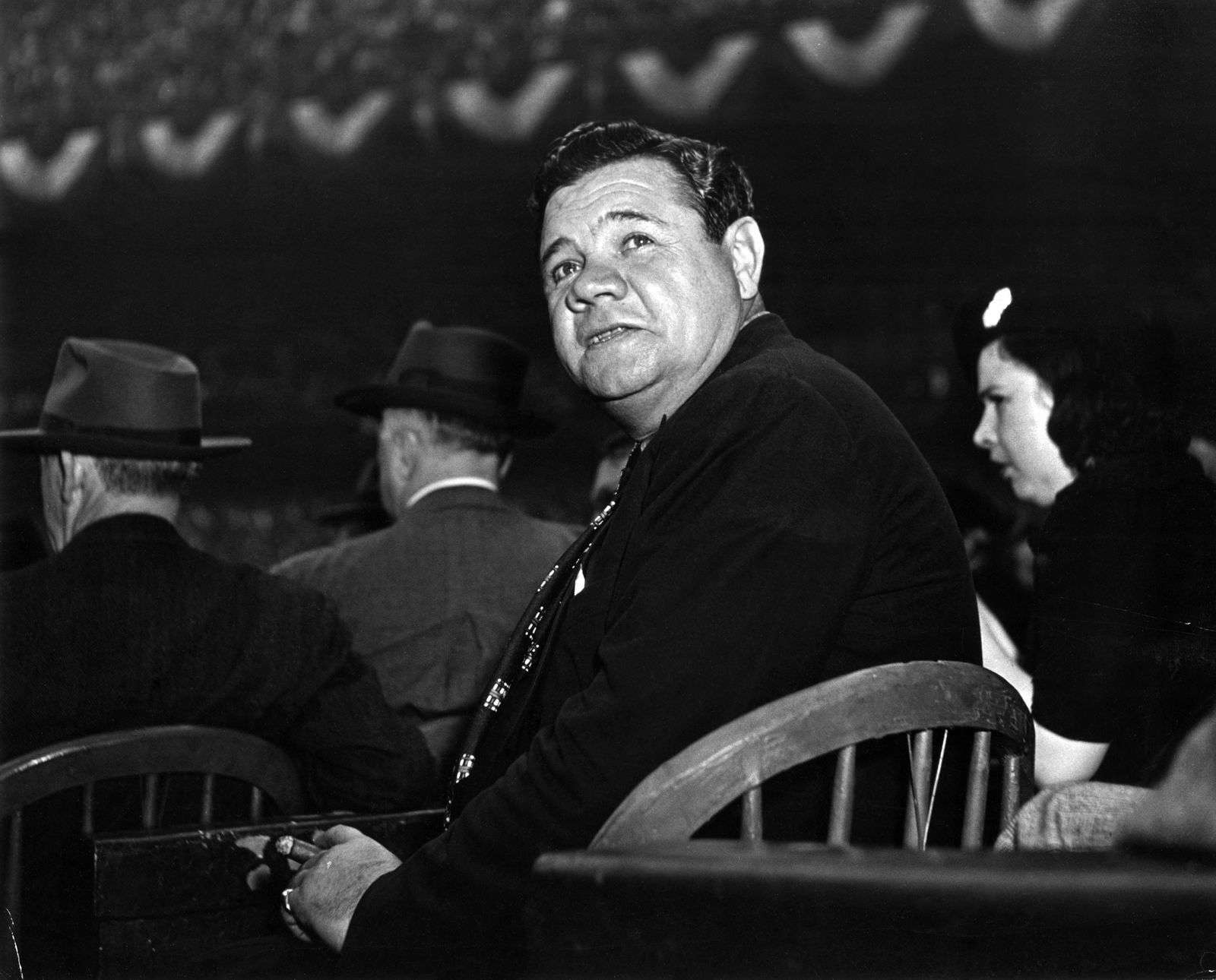 W. E SMITH, BABE RUTH IN THE STANDS AT THE WORLD SERIES: W. EUGENE SMITH (1918-1978), BABE RUTH SITTING IN THE STANDS AT THE WORLD SERIES, 1941, gelatin silver print, printed later; 7 5/8 x 9 3/8 in. (image); photographer's 'Black Star' stamp verso; Conditi