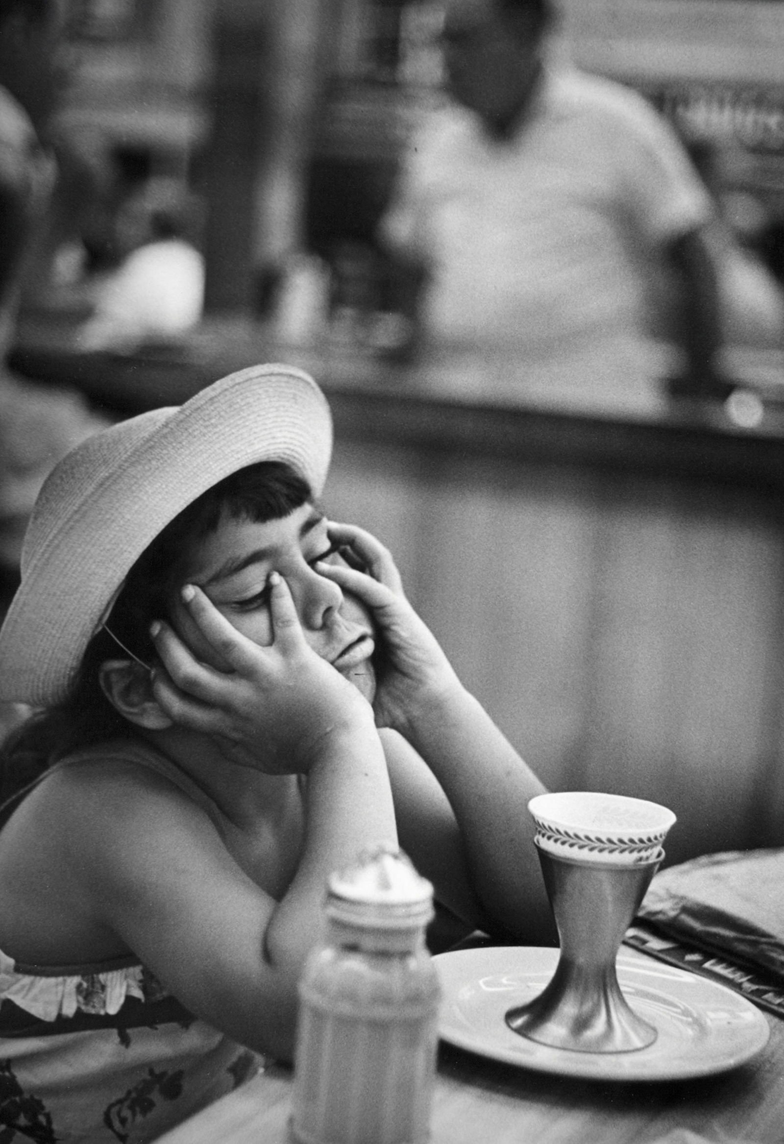 W. E. SMITH, JUANITA AT THE SODA FOUNTAIN, 1950: W. EUGENE SMITH (1918-1978), JUANITA AT THE SODA FOUNTAIN, 1950 gelatin silver print, printed later; 13 3/8 x 8 7/8 in. (image); 11 x 14in. (sheet); stamped verso. Condition: Excellent; WES-0004 Portr