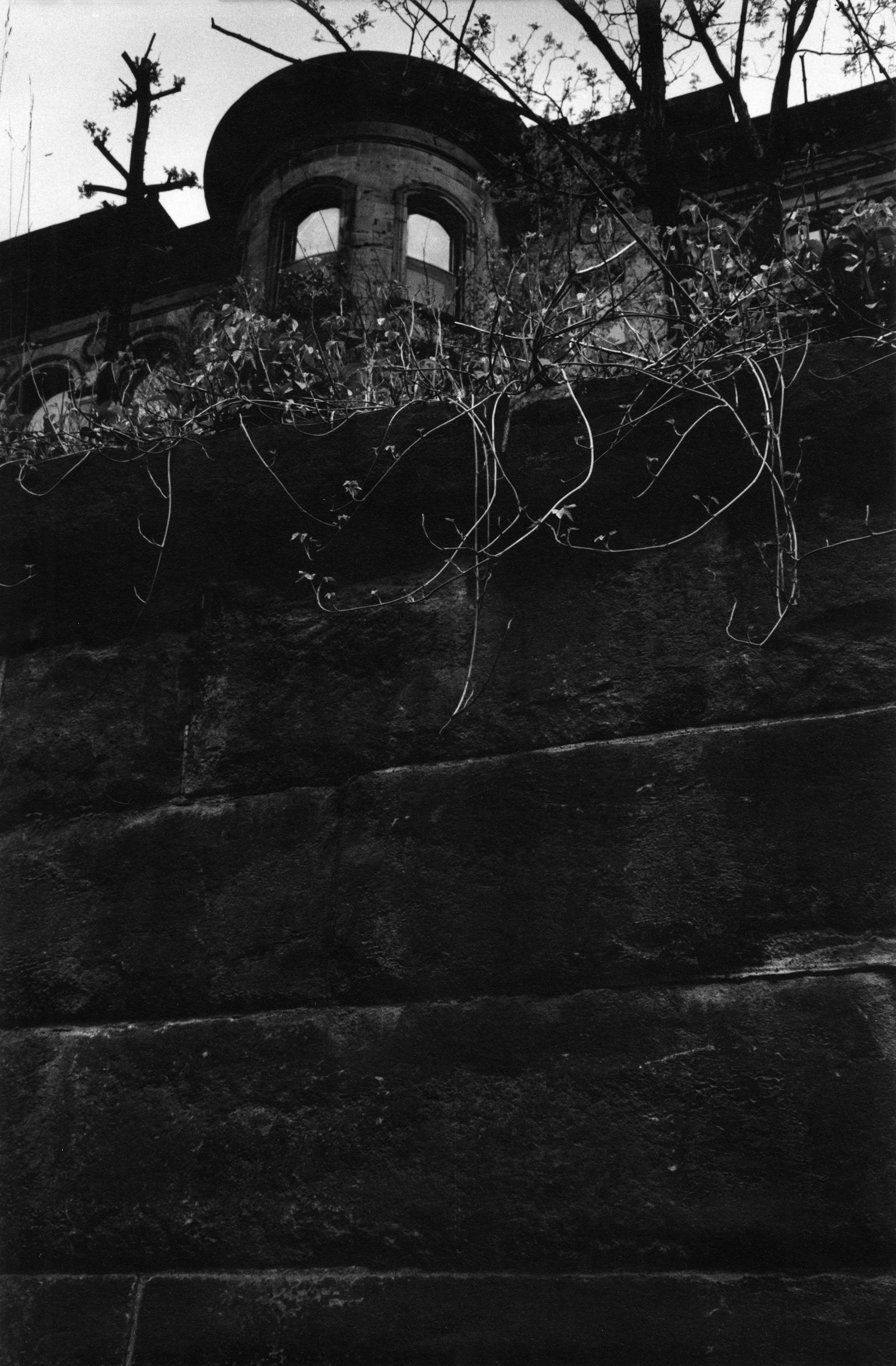 W. E. SMITH, HOUSE WITH EYES, FROM PITTSBURGH, 1955-56: W. EUGENE SMITH (1918-1978), HOUSE WITH EYES, from PITTSBURGH, 1955-56, gelatin silver print, printed later; 13 5/8 x 9 in. (image); 11 x 14 in. (sheet); W. Eugene Smith estate stamp verso in ink. Con