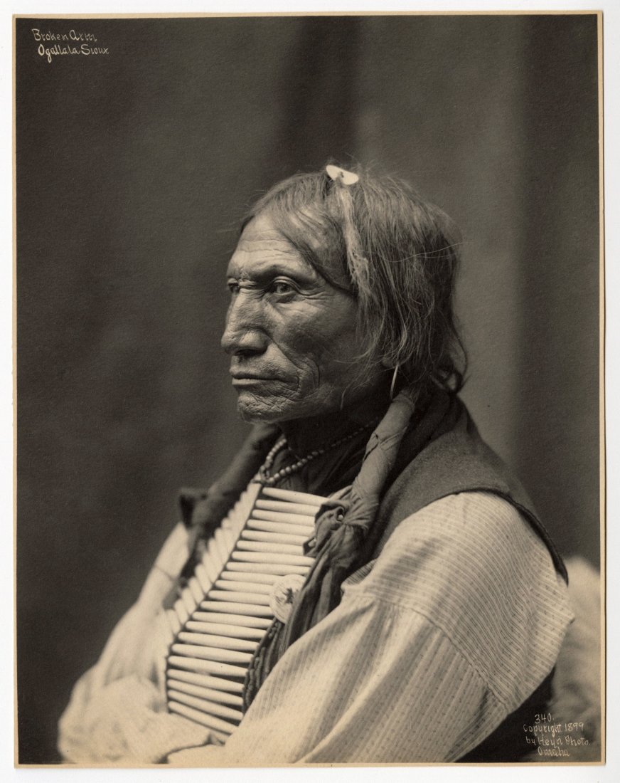 HEYN STUDIOS, BROKEN ARM - OGALALLA SIOUX, 1899: HEYN STUDIOS, BROKEN ARM, OGLLALA SIOUX, 1899 vintage platinum print, 8 7/8 x 7 7/8 inches, title, date, number, artist studio in negative, numbered 340. Condition: Excellent. HEY-0007 CONDITION: For