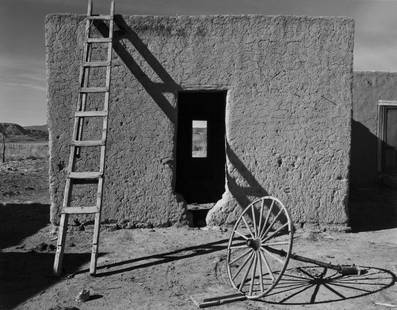 WRIGHT MORRIS, ADOBE HOUSE, WAGON WHEEL, NM, 1940: WRIGHT MORRIS (1910-1998), ADOBE HOUSE, WAGON WHEEL, NEW MEXICO, 1940 gelatin silver print, printed later, 7 x 9 in. (image); signed verso with notations in pencil. Condition: Excellent. WMO-0061 