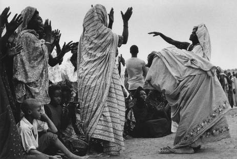 BERNARD PLOSSU, THE GUEDRA, MOORISH DANCE, SENEGAL, 1976: BERNARD PLOSSU (1945-), THE GUEDRA, MOORISH DANCE, SENEGAL,1976 gelatin silver print, 7 3/4 x 11 3/4 in. (image), 11 x 14 in. (sheet); signed, titled, dated verso in pencil. Condition: Excellent.