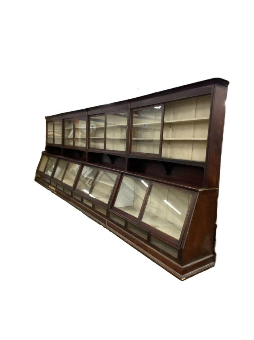 Large Antique apothecary general store cabinet: awesome slant front cabinet in pretty good condition. Missing one sliding glass door and some of the trim pieces need reattached but they are present.