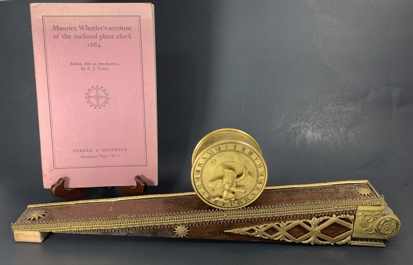 An Exceptionally Rare & Important 17th Century Clock: Available is an incredibly rare and important antique mechanism & time-keeping instrument. The invention of the 24-hour Rolling Drum Inclined Plane Clock was credited to Maurice Wheeler, 1684. The par