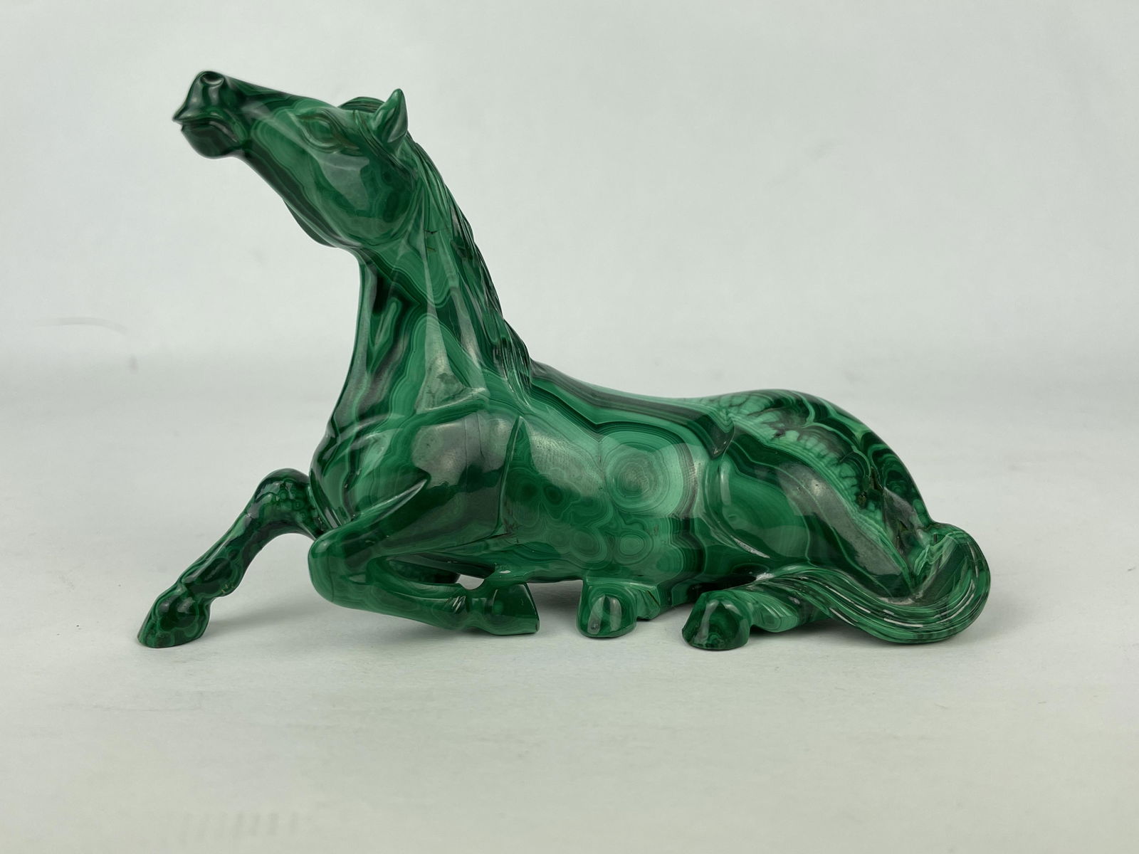 A Chinese Carved Malachite Figure of A Horse: A Chinese Carved Malachite Figure of A Horse, 20th Century. Approximate Dimensions: 3 inches (height)