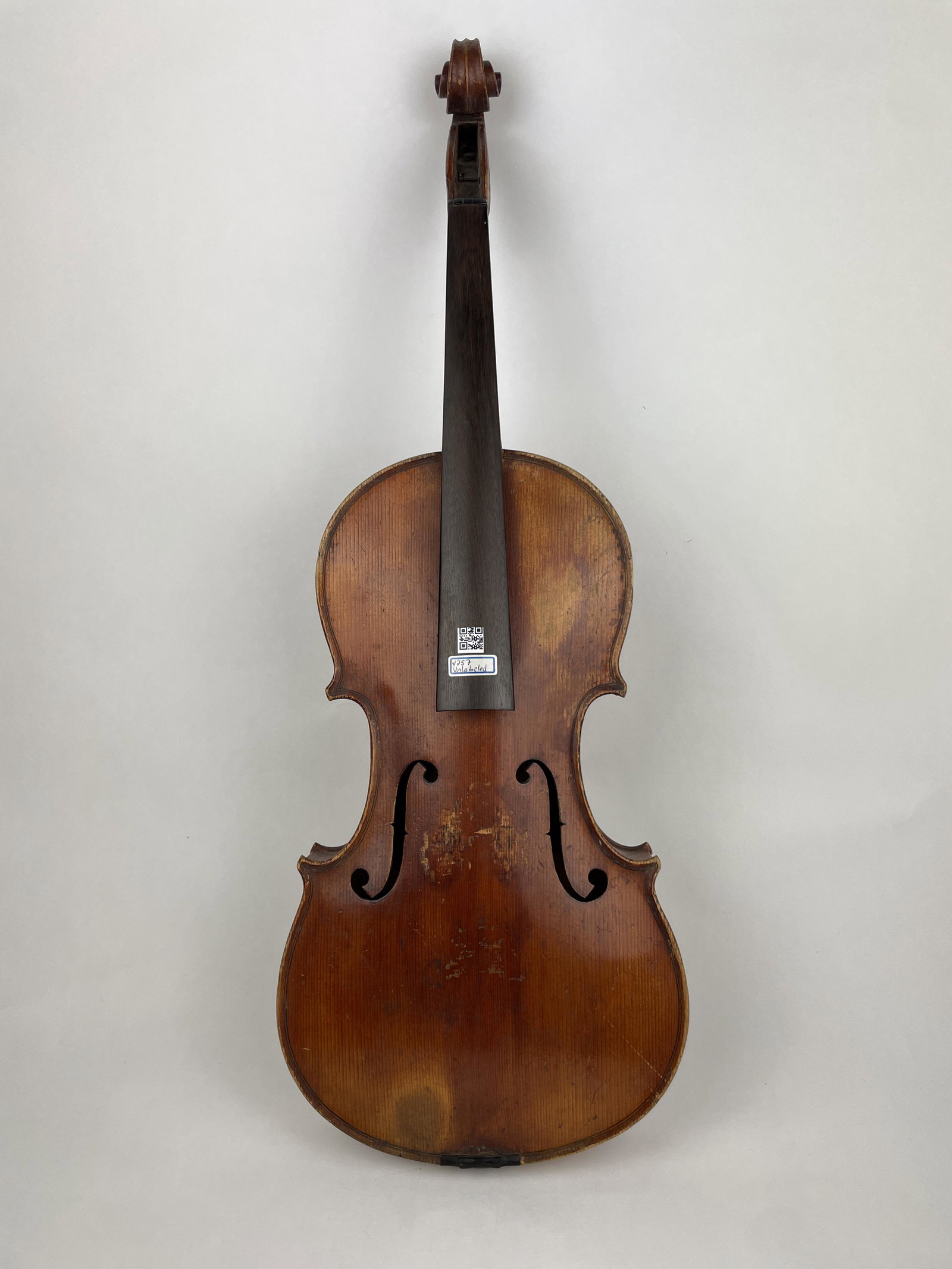 An Unlabelled Violin: An Unlabelled Violin with old shop tags. Provenance: Property of a Gentleman, life long collector and expert of Violins, Violincellos, Violas and Bows Approximate Dimensions: 23.25 inches (Total Lengt
