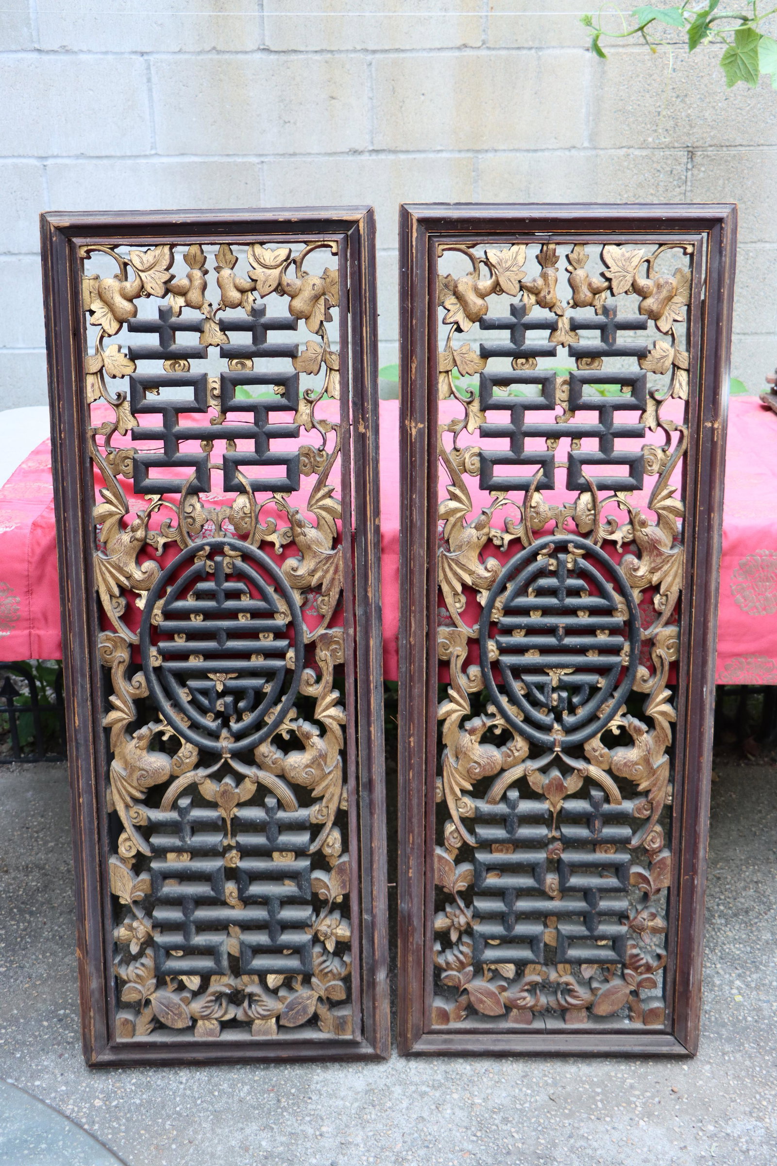 A Large Pair of Chinese Gilt Lacquer Pierce Carved Relief Panels: A Large Pair of Chinese Gilt Lacquer Pierce Carved Relief Panels featuring excellent pierce carved motifs of Bats, clouds and Auspicious Chinese characters such as "Double Happiness" all interwoven. T