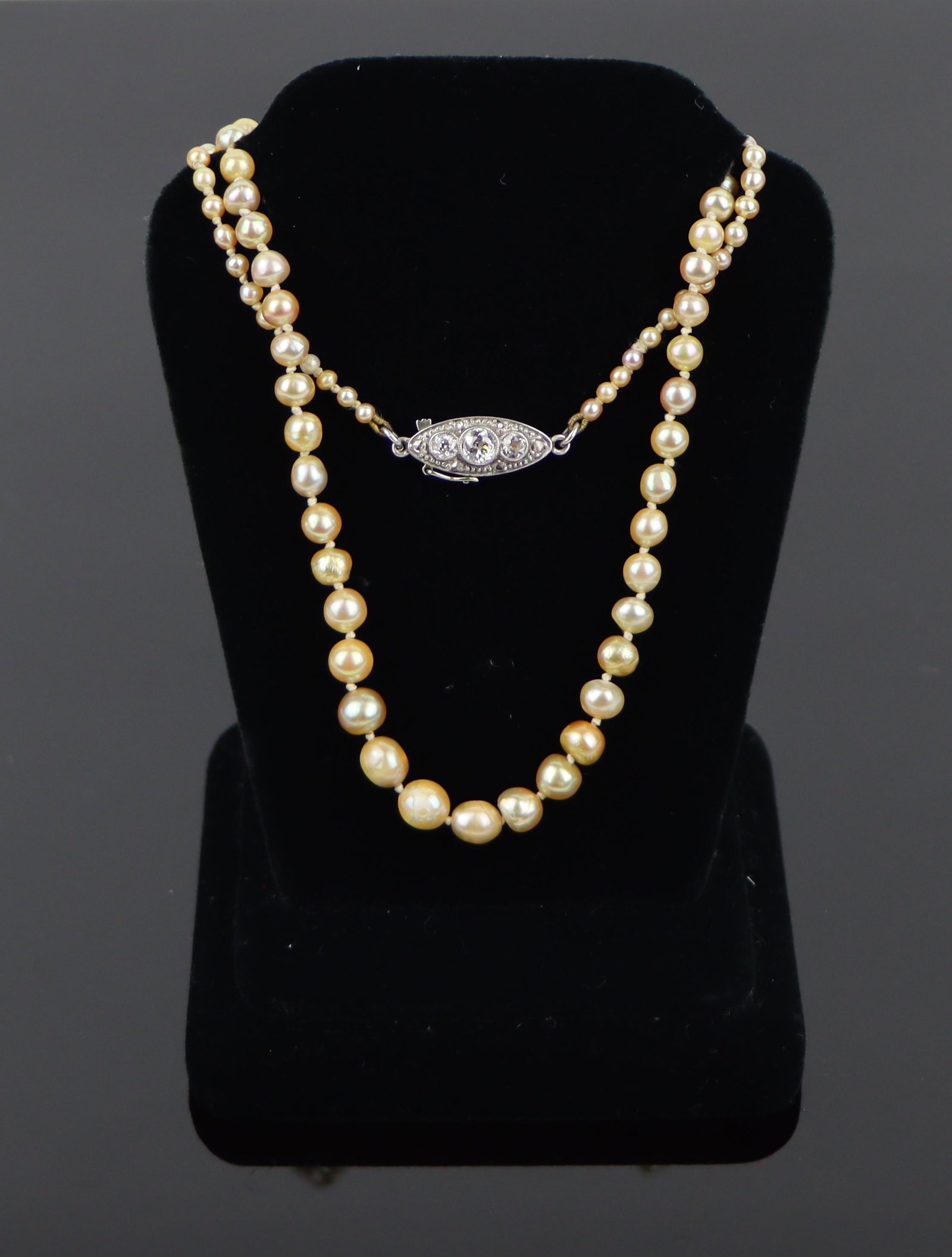 Vintage GIA Certified Natural Pearl and Diamond Necklace: GIA Certified Natural Pearl and Diamond Necklace A Strand of (94) Natural Saltwater Pearls and (1) Immitation Pearl - Center Pearl. The necklace features a 0.50 TCW Diamond Clasp. The Necklace is acco