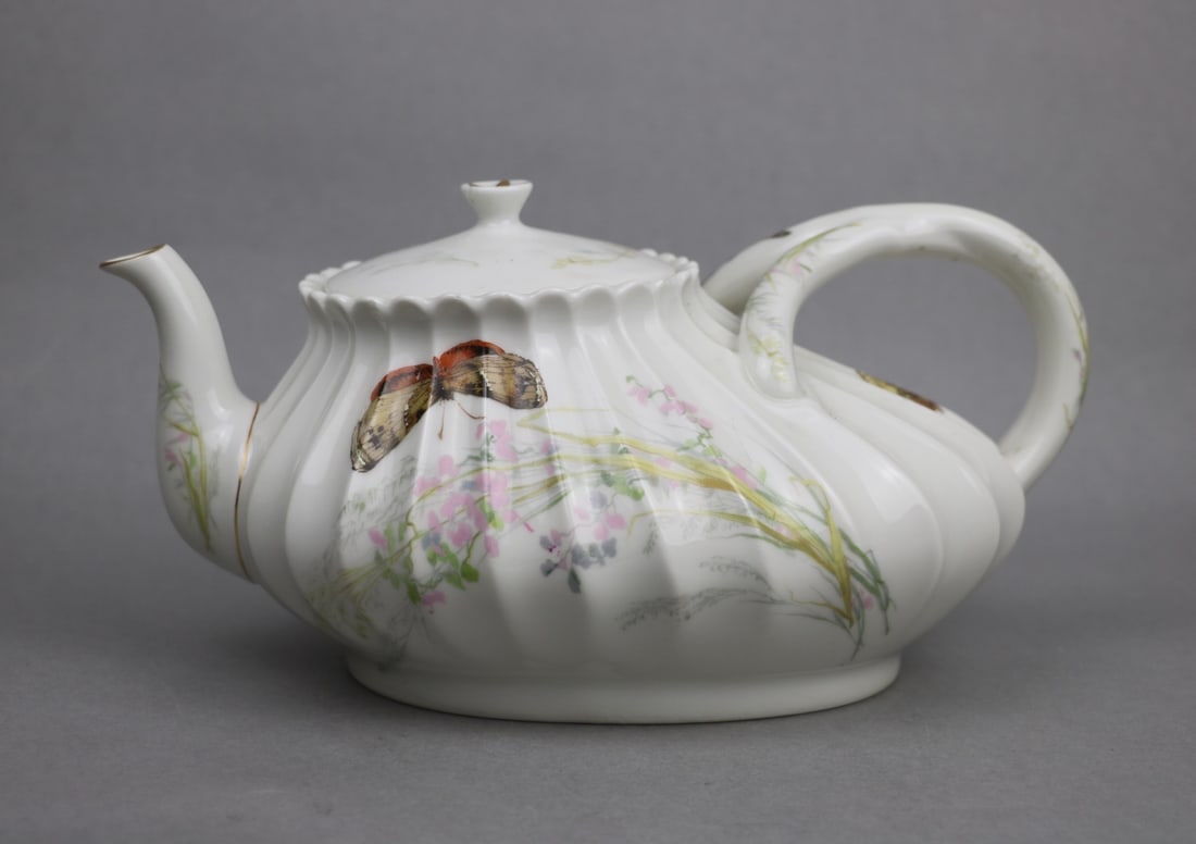 Haviland & Co Limoges Hand Painted Rare Shape Porcelain Teapot: Haviland & Co Limoges Hand Painted Rare Shape Porcelain Teapot Approximate Dimensions: 4.75 inches (Height) x 9.5 inches (Width) x 2.8 inches (Lip Diameter) x 5.3 inches x 4 inches (Base)
