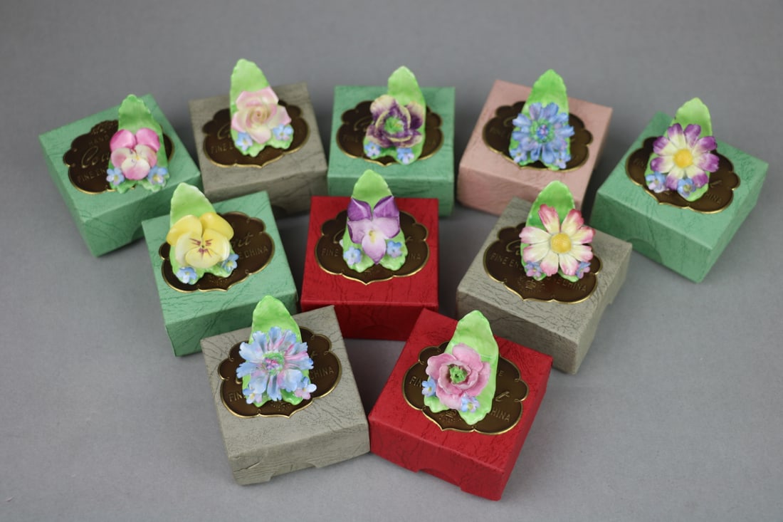 A Lot of Ten Coalport Fine English Bone China Flower Porcelain Place Card Holders: A Lot of Ten Coalport Fine English Bone China Flower Porcelain Place Card Holders Approximate Dimensions: 1.15 inches (Height) x 1.1 inches (Width) x 1.5 inches (Length)