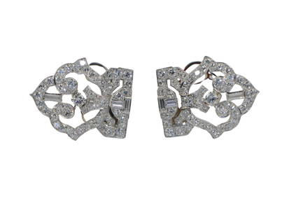 Art Deco Tiffany & Co Diamond Platinum Double Clip Brooch: Art Deco Tiffany & Co Diamond Platinum Double Clip Brooch A rare Art Deco example of a pair of Double Clip brooches from the Jewelry House of Tiffany & Co. Finely Crafted in Platinum and mounted with