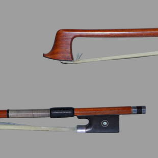 A Silver Violin Bow: Of Octagonal Pernambuco Stick, Ebony & Silver mounted. UnStamped Approximate Dimensions: 74.1 cm (Total Length - Head to Button) 58.7 Grams in weight