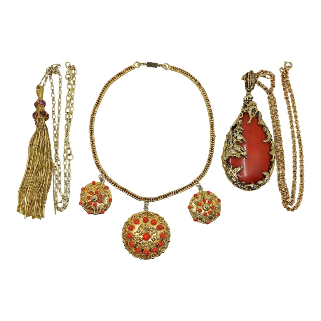 Three Piece Lot of Gold Tone Faux Coral Tassel Necklaces: Three Piece Lot of Gold Tone Faux Coral Tassel Necklaces Approximate Dimensions: 41 cm - 71cm (Unclasped Length) 4 cm - 13.4 cm(Pendant Length) 168.1 grams in total weight.